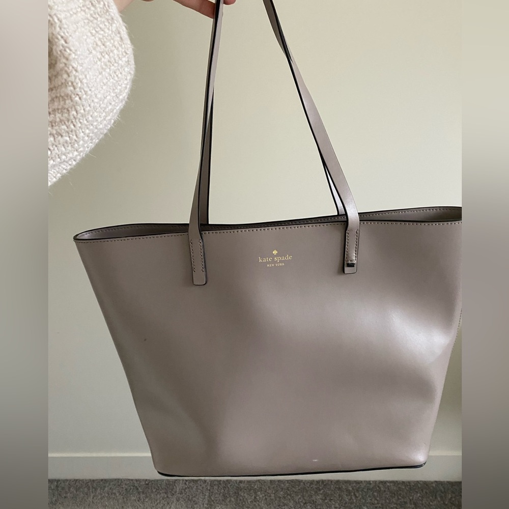 Grey Kate Spade tote bag. Mint condition. Retail was $368, used a few times.